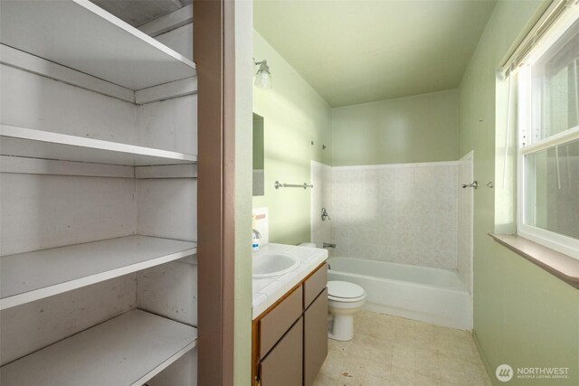 300 N St, Sequim, WA 98382 - bathroom with vanity, toilet, a bath, and tile patterned floors
