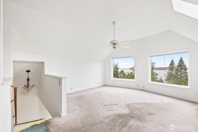 300 N St, Sequim, WA 98382 - unfurnished living room with lofted ceiling, carpet floors, and a ceiling fan