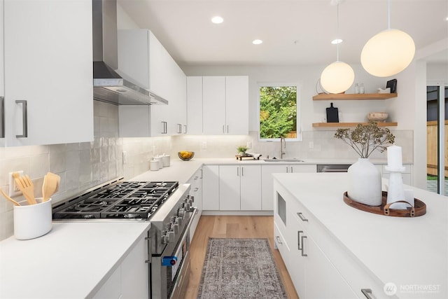 10304 NE 113th Pl, Kirkland, WA 98033 - kitchen featuring wall chimney range hood, high end range, recessed lighting, a sink, and backsplash