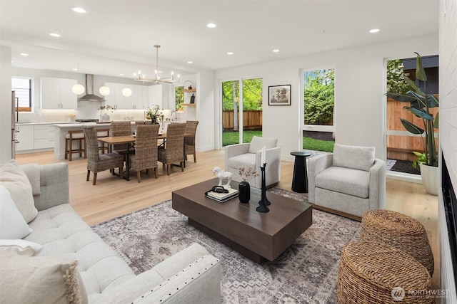 10304 NE 113th Pl, Kirkland, WA 98033 - living area with light wood-style floors, a chandelier, and recessed lighting