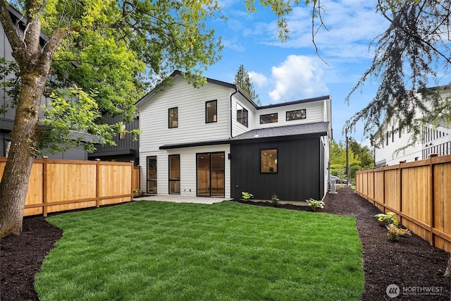 10304 NE 113th Pl, Kirkland, WA 98033 - back of house featuring board and batten siding and a patio area