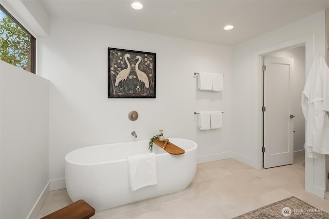 10304 NE 113th Pl, Kirkland, WA 98033 - full bath featuring a freestanding bath, recessed lighting, and baseboards