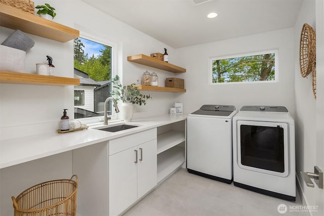 10304 NE 113th Pl, Kirkland, WA 98033 - laundry room featuring washing machine and dryer, recessed lighting, and cabinet space