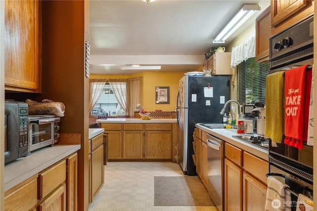 14904 108th Pl NE, Bothell, WA 98011 - kitchen featuring a sink, stainless steel appliances, light countertops, brown cabinets, and light floors