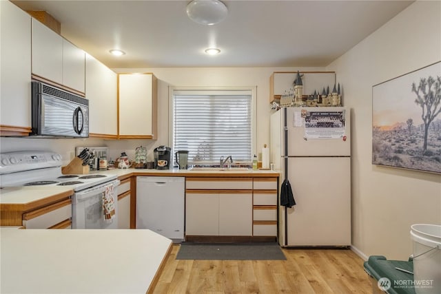 14904 108th Pl NE, Bothell, WA 98011 - kitchen featuring white appliances, a sink, light wood-style floors, light countertops, and recessed lighting