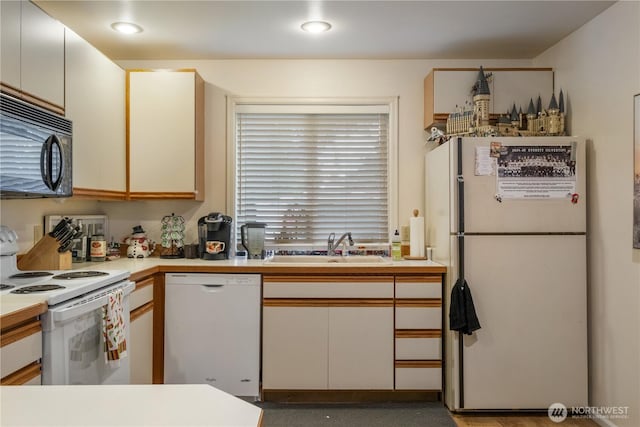 14904 108th Pl NE, Bothell, WA 98011 - kitchen featuring white appliances, a sink, and light countertops