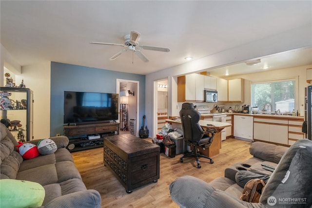 14904 108th Pl NE, Bothell, WA 98011 - living room with light wood finished floors and a ceiling fan