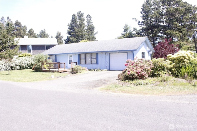 19494 N N Pl, Long Beach, WA 98631 - single story home featuring an attached garage, a deck, and dirt driveway