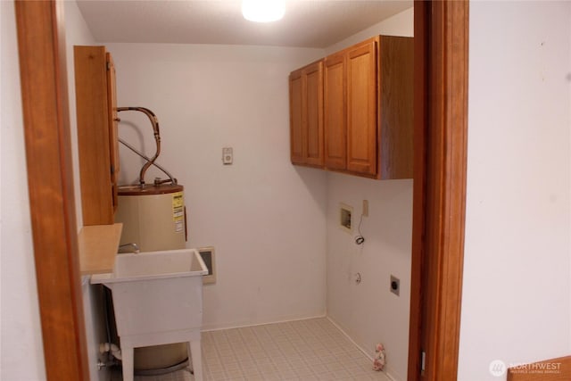 19494 N N Pl, Long Beach, WA 98631 - laundry area featuring cabinet space, hookup for an electric dryer, water heater, hookup for a washing machine, and hookup for a gas dryer