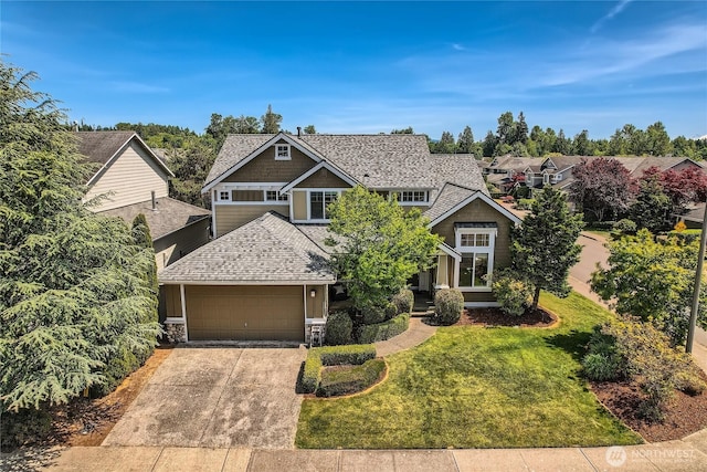 270 Kitsap Ave NE, Renton, WA 98059 - craftsman-style home with a shingled roof, a front lawn, a garage, concrete driveway, and stone siding