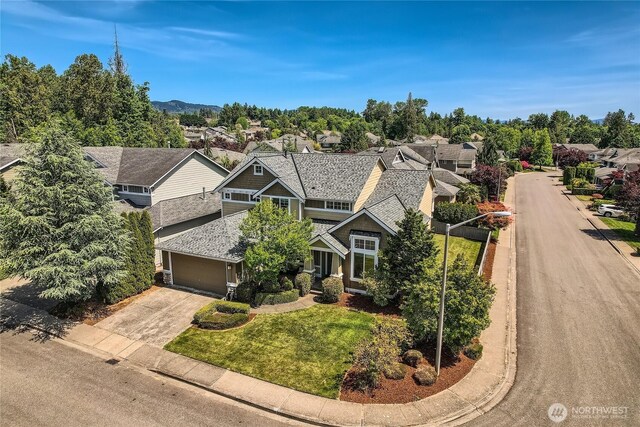 270 Kitsap Ave NE, Renton, WA 98059 - view of front of property with concrete driveway, a residential view, and a front lawn