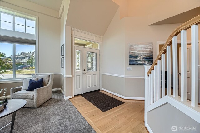270 Kitsap Ave NE, Renton, WA 98059 - foyer entrance with stairway, wood finished floors, baseboards, and lofted ceiling