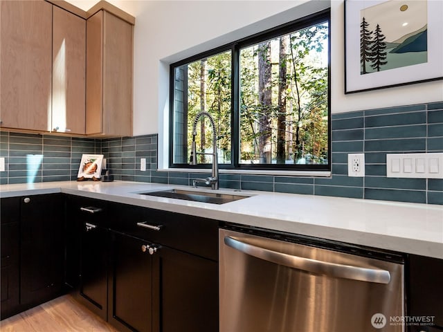 7400 Miller Way, Glacier, WA 98244 - kitchen featuring stainless steel dishwasher, a sink, decorative backsplash, and light stone counters