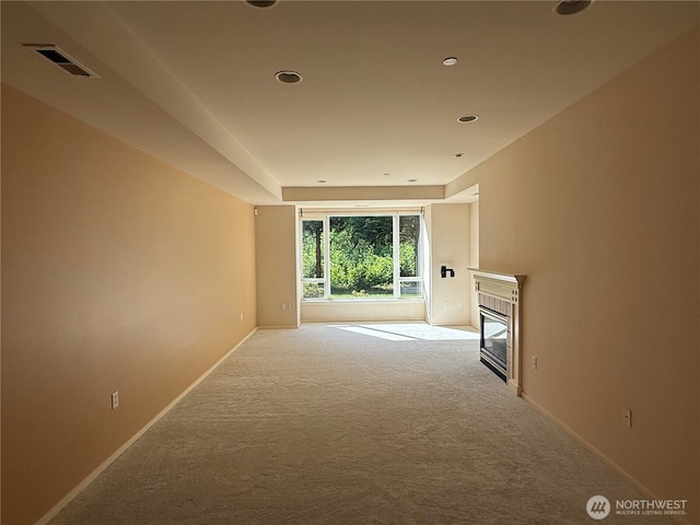 1805 134th Ave NE Unit 8, Bellevue, WA 98005 - unfurnished living room featuring carpet floors, a glass covered fireplace, baseboards, and recessed lighting