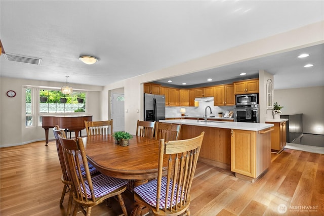 12012 County Line Rd E, Edgewood, WA 98372 - dining area with light wood-type flooring and recessed lighting