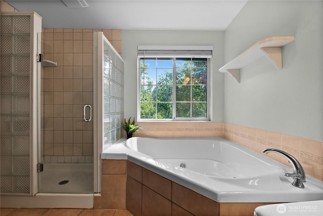 12012 County Line Rd E, Edgewood, WA 98372 - full bath featuring a stall shower, a garden tub, and tile patterned flooring