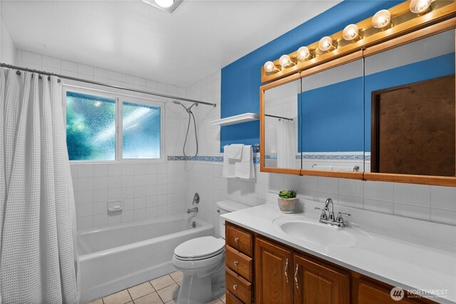 12012 County Line Rd E, Edgewood, WA 98372 - bathroom featuring vanity, shower / bath combo with shower curtain, and tile patterned floors