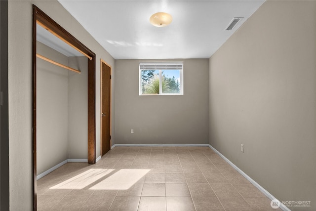 12012 County Line Rd E, Edgewood, WA 98372 - unfurnished bedroom featuring tile patterned floors and a closet