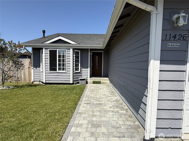 11426 SE 307th Pl, Auburn, WA 98092 - view of exterior entry featuring a yard and a shingled roof