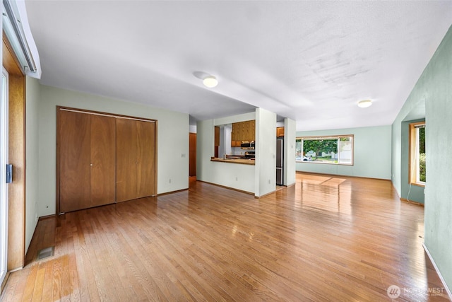 873 Fern Dr, Lynden, WA 98264 - unfurnished living room with light wood-type flooring and baseboards