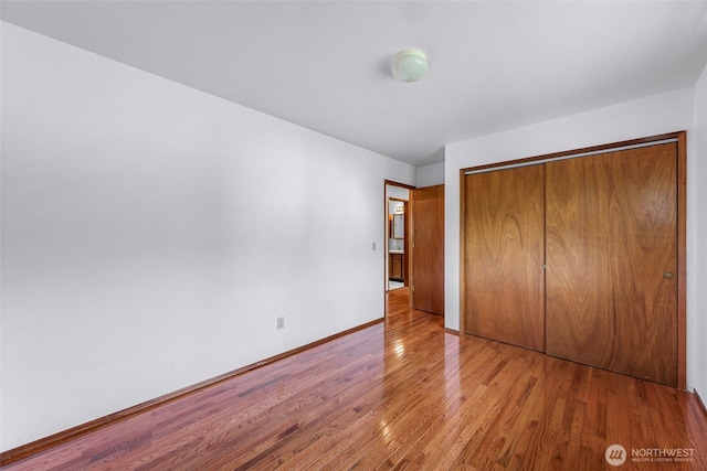 873 Fern Dr, Lynden, WA 98264 - unfurnished bedroom featuring wood finished floors, a closet, and baseboards
