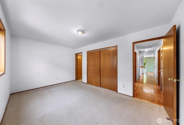 873 Fern Dr, Lynden, WA 98264 - unfurnished bedroom with a closet, light colored carpet, and baseboards