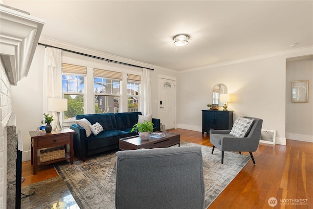 707 N Adams St, Tacoma, WA 98406 - living area featuring crown molding, baseboards, a fireplace, and wood finished floors