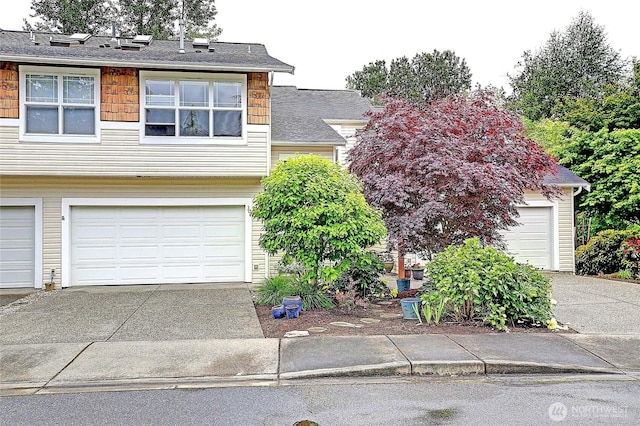 7318 Centerville Ct Unit 304, Stanwood, WA 98292 - view of front of home featuring concrete driveway and a garage