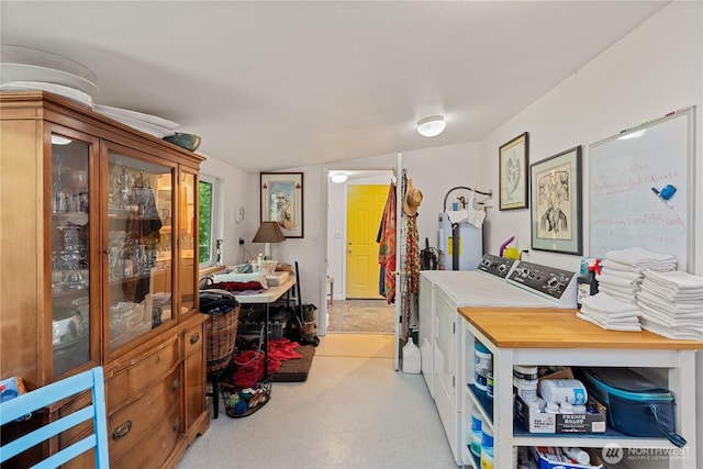 973 US Highway 101, Cosmopolis, WA 98537 - home office featuring washing machine and clothes dryer, light carpet, and electric water heater