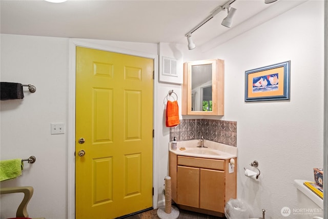 973 US Highway 101, Cosmopolis, WA 98537 - bathroom with vanity, tasteful backsplash, toilet, and track lighting