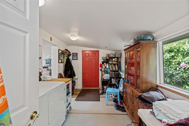 973 US Highway 101, Cosmopolis, WA 98537 - laundry room with washing machine and dryer, plenty of natural light, and light carpet