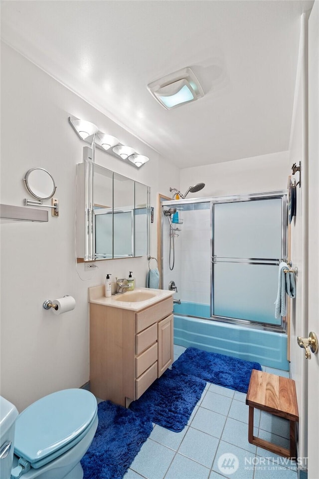 973 US Highway 101, Cosmopolis, WA 98537 - full bathroom with toilet, vanity, shower / bath combination with glass door, and tile patterned flooring