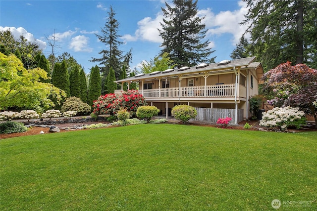 4701 161st St E, Tacoma, WA 98446 - back of property featuring a lawn and a wooden deck