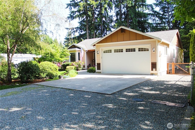 17247 154th Ave SE, Yelm, WA 98597 - single story home featuring an attached garage, concrete driveway, board and batten siding, and a gate
