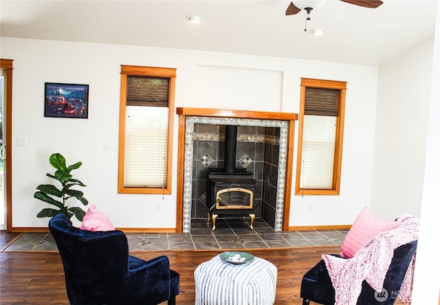 17247 154th Ave SE, Yelm, WA 98597 - living room featuring a wood stove, baseboards, a ceiling fan, wood finished floors, and recessed lighting