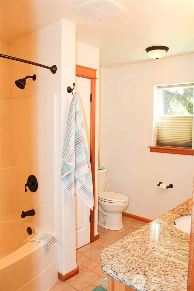 17247 154th Ave SE, Yelm, WA 98597 - bathroom with vanity, tile patterned floors, toilet, bathing tub / shower combination, and baseboards