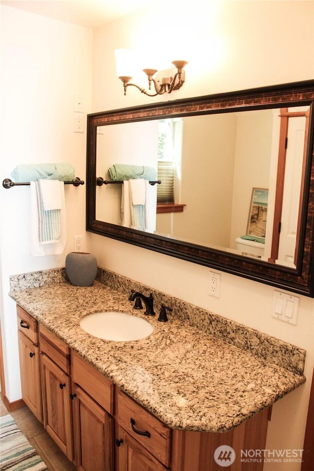 17247 154th Ave SE, Yelm, WA 98597 - bathroom with vanity, toilet, and tile patterned floors