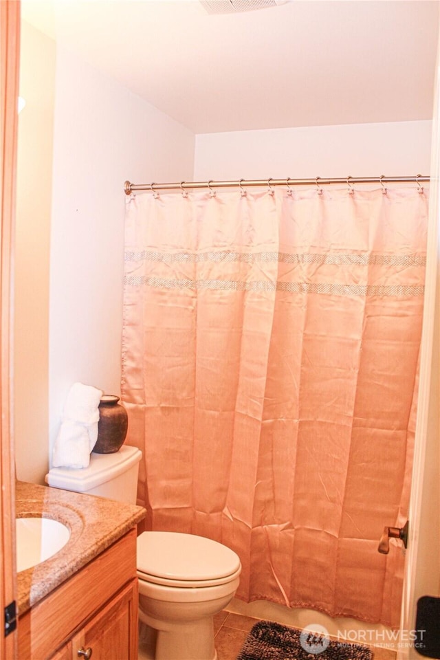 17247 154th Ave SE, Yelm, WA 98597 - full bathroom featuring vanity, toilet, tile patterned floors, and a shower with shower curtain