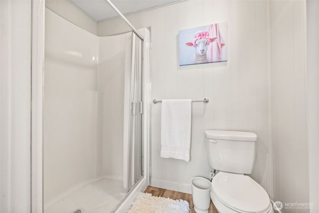 12615 113th St E Unit 249, Puyallup, WA 98374 - bathroom with a stall shower, wood finished floors, and toilet