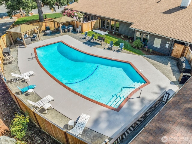 12615 113th St E Unit 249, Puyallup, WA 98374 - view of pool featuring a gazebo, an outdoor living space, a fenced backyard, and a patio area