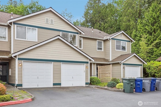 21616 9th Ave SE Unit C-105, Bothell, WA 98021 - townhome / multi-family property featuring asphalt driveway, a garage, and a shingled roof