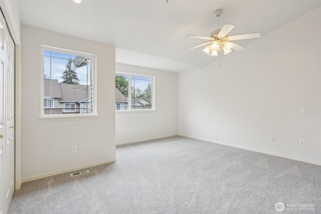 21616 9th Ave SE Unit C-105, Bothell, WA 98021 - carpeted empty room with baseboards and ceiling fan