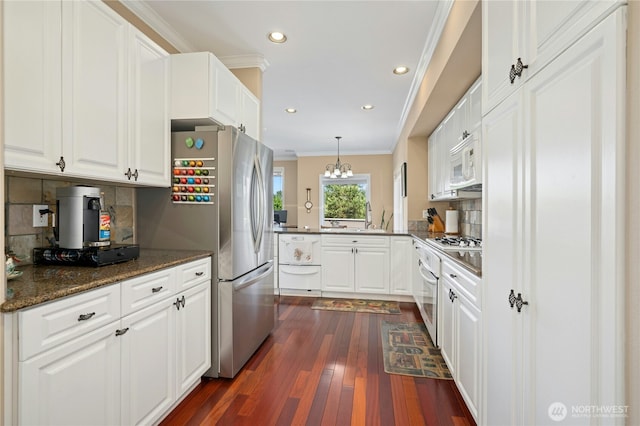 12232 SE 80th Way, Newcastle, WA 98056 - kitchen with ornamental molding, white appliances, decorative backsplash, a peninsula, and white cabinetry