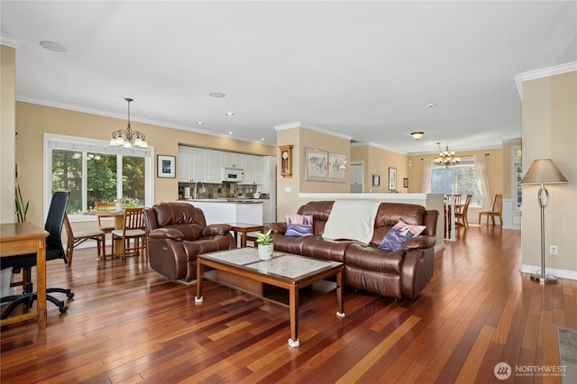 12232 SE 80th Way, Newcastle, WA 98056 - living area featuring a chandelier, wood-type flooring, crown molding, recessed lighting, and baseboards