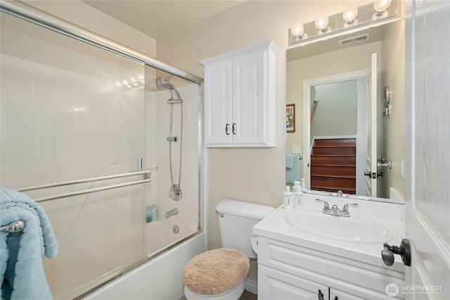 12232 SE 80th Way, Newcastle, WA 98056 - bathroom featuring vanity, bath / shower combo with glass door, and toilet