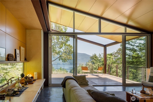 271 Blanc Rd, Orcas Island, WA 98245 - living room with expansive windows, a mountain view, and finished concrete flooring