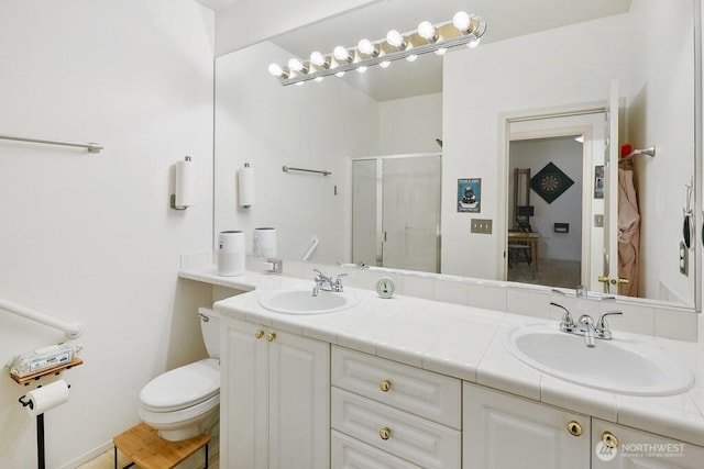 12712 Admiralty Way Unit G102, Everett, WA 98204 - full bathroom with a stall shower, double vanity, and toilet