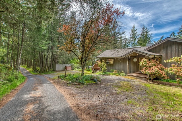 121 Switchback Rd, Orcas Island, WA 98245 - view of side of home featuring a chimney and driveway