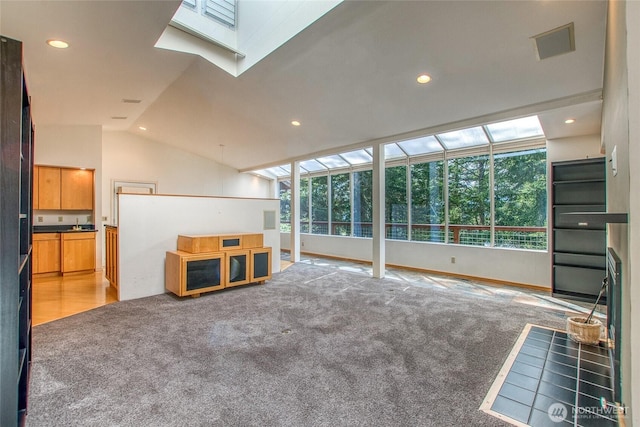 121 Switchback Rd, Orcas Island, WA 98245 - unfurnished living room featuring plenty of natural light, light carpet, vaulted ceiling, and recessed lighting
