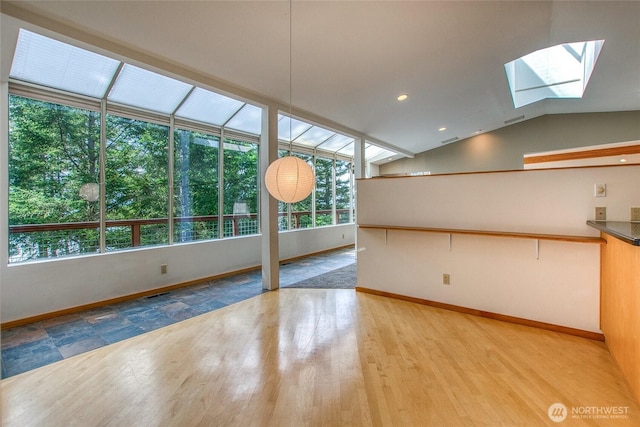 121 Switchback Rd, Orcas Island, WA 98245 - spare room with a skylight, wood finished floors, baseboards, and vaulted ceiling
